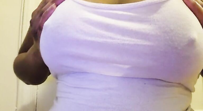 Ebony babe plays with oily tits, shows off big brown areolas