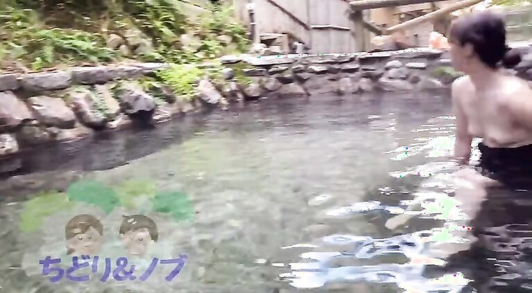 An amateur woman taking a bath while being seen by a man in a mixed bathing hot spring.