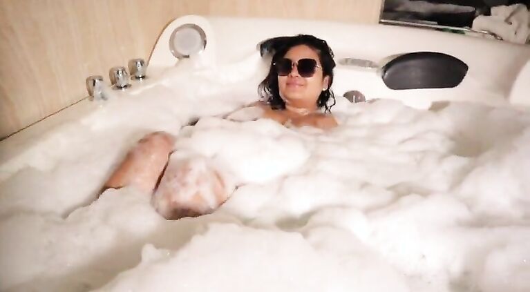 Busty Latina mischief in the hot tub
