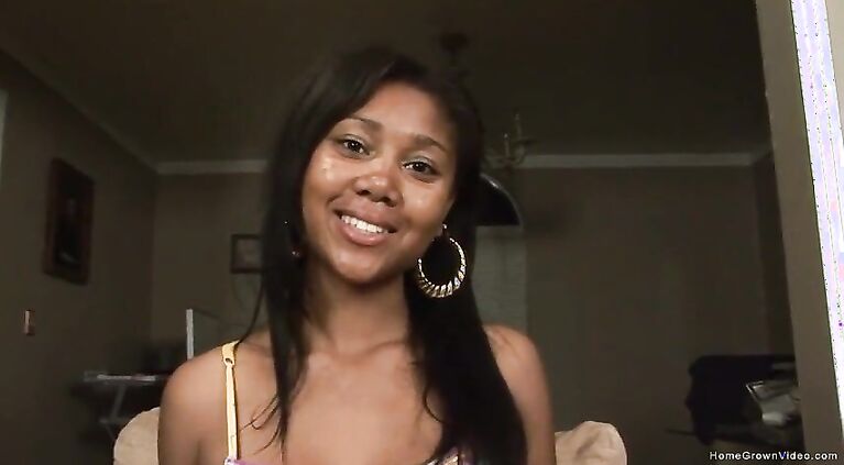 Thin ebony babe masturbates with a big purple dildo