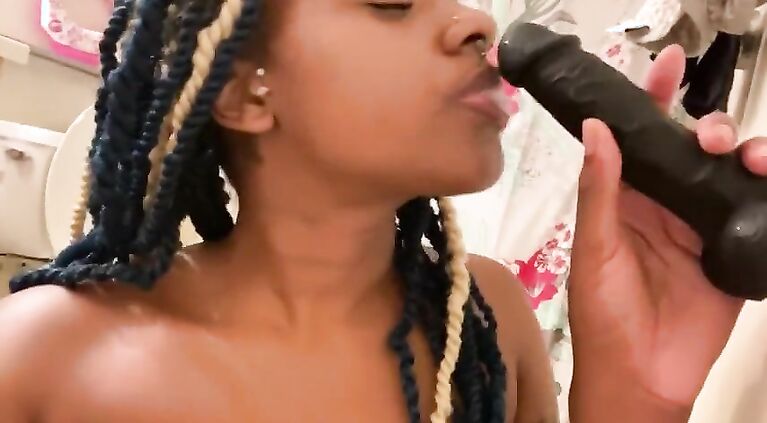 Sucking in a dildo for a fan